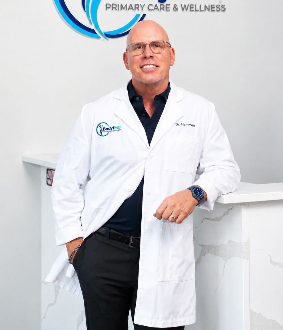 Dr. Andrew Hemmen in his white coat at Body1MD