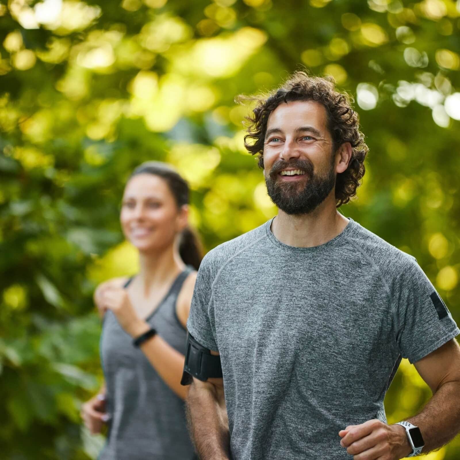Two people running outdoors together